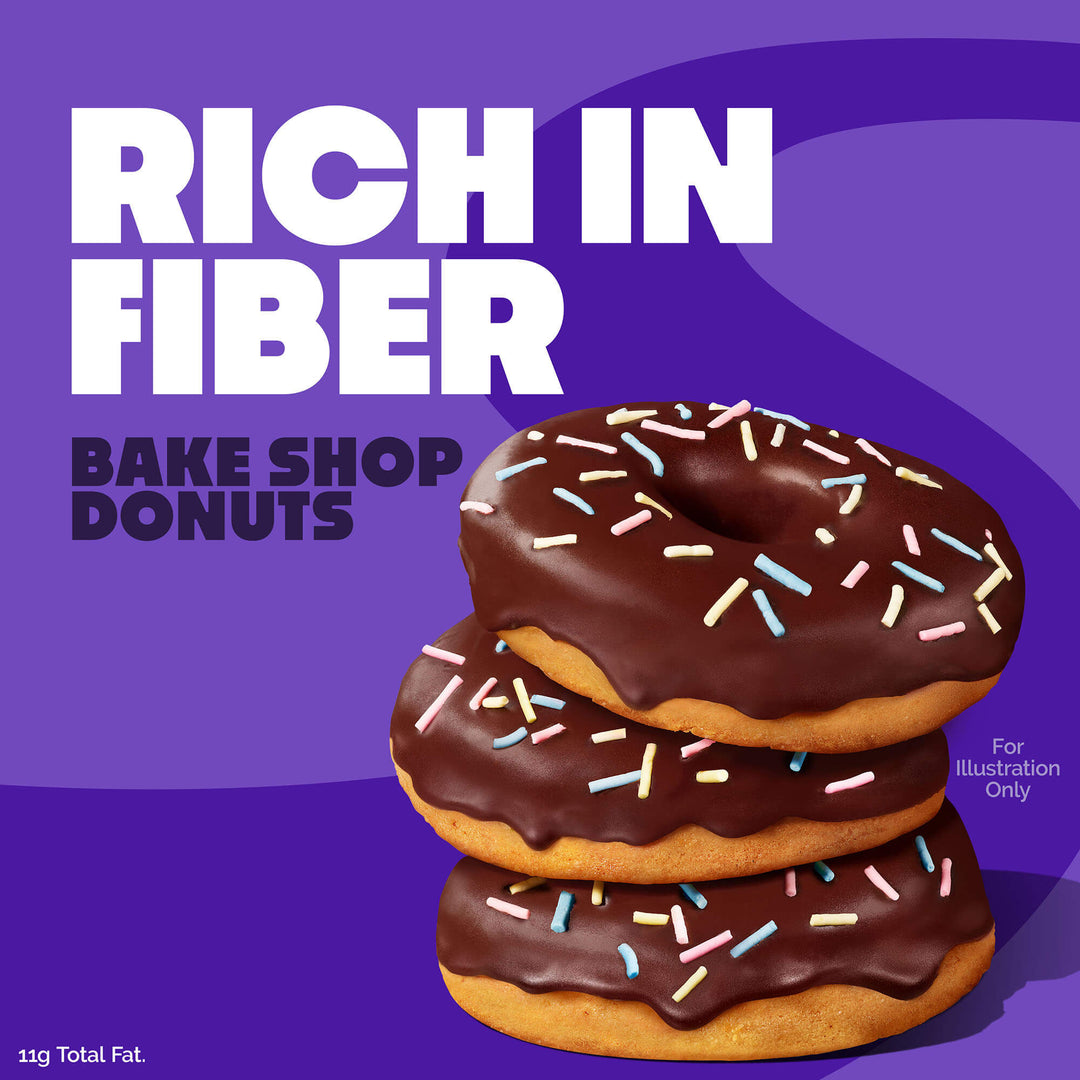 Stack of chocolate-glazed donuts with sprinkles on a purple background, labeled 'Rich in Fiber' and 'Bake Shop Donuts'.