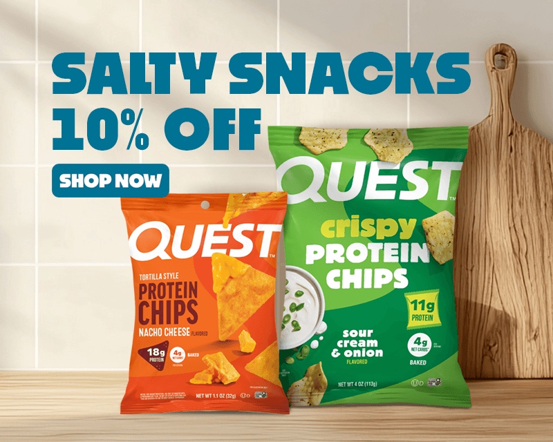 Text reads 'Salty Snacks 10% Off. Shop Now.' Advertisement featuring two bags of Quest protein chips on a wooden countertop.Relaxed kitchen setting with cutting boards and a plant in the background.