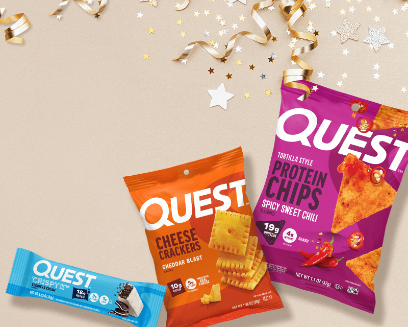 Quest snacks including cheese crackers, protein chips, and a cookies & cream bar, surrounded by gold and silver star confetti on a beige background.