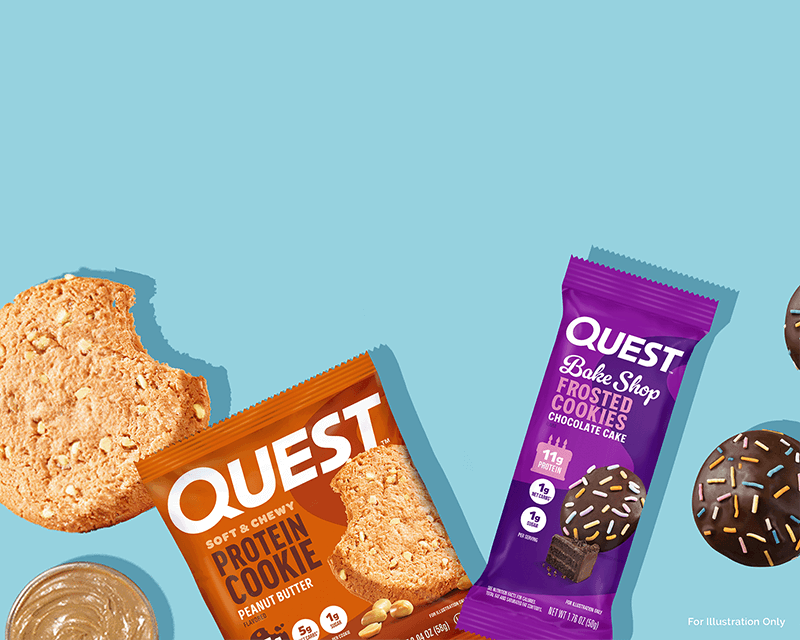 Quest protein cookies against a blue background. An open peanut butter cookie with packaging and a chocolate cake cookie still wrapped, creating a tempting and vibrant snack display.