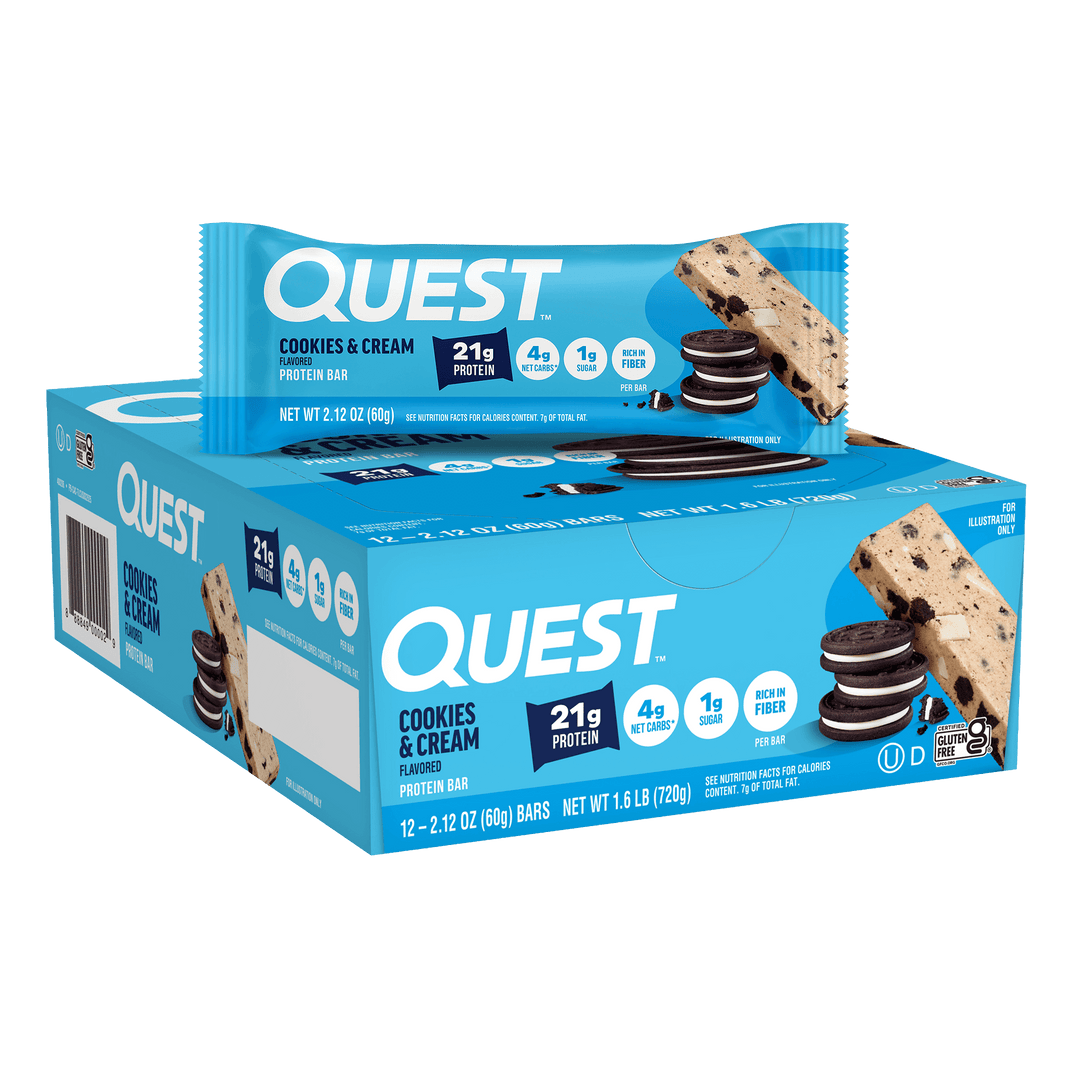 Quest Cookies & Cream protein bar box, with a bar resting on top. The blue packaging highlights 21g protein, 4g net carbs, and 1g sugar per bar.