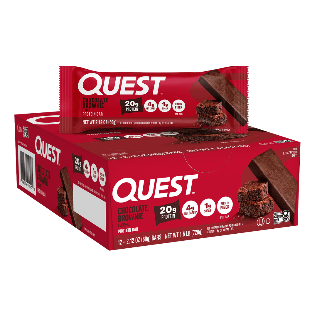 A red Quest Chocolate Brownie protein bar wrapper displayed on a matching box. The packaging highlights 20g protein, 4g net carbs, 1g sugar, conveying a high-protein, low-sugar snack option.