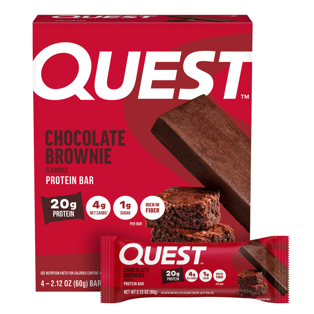 Red and brown Quest box and protein bar wrapper with chocolate brownie imagery. Text highlights "20g protein," "4g net carbs," and "1g sugar."
