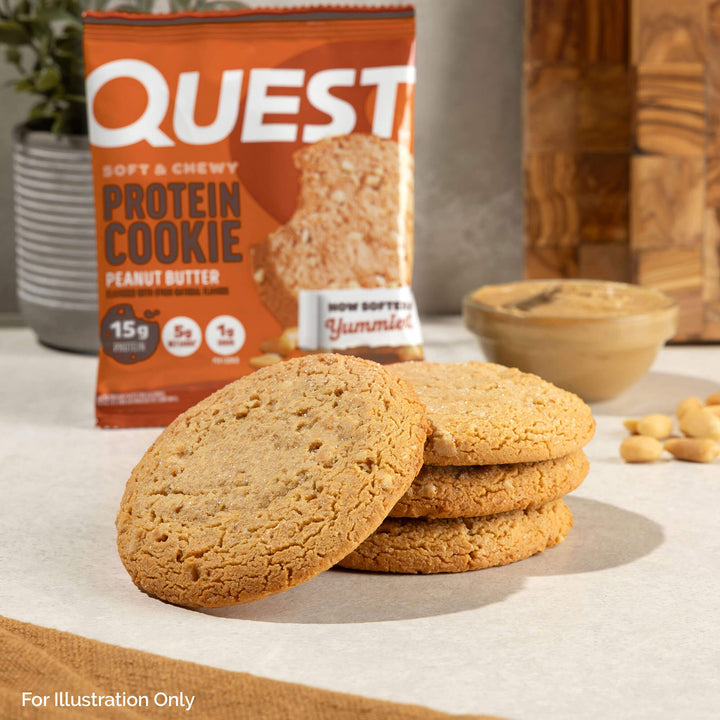 Peanut Butter Protein Cookies unwrapped with peanuts at the background