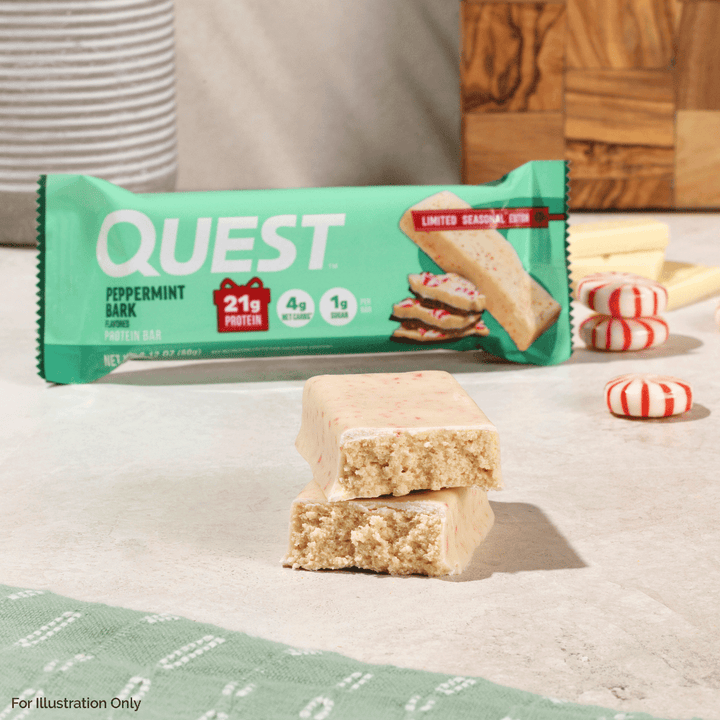 Quest Peppermint Bark protein bar with packaging on a light surface