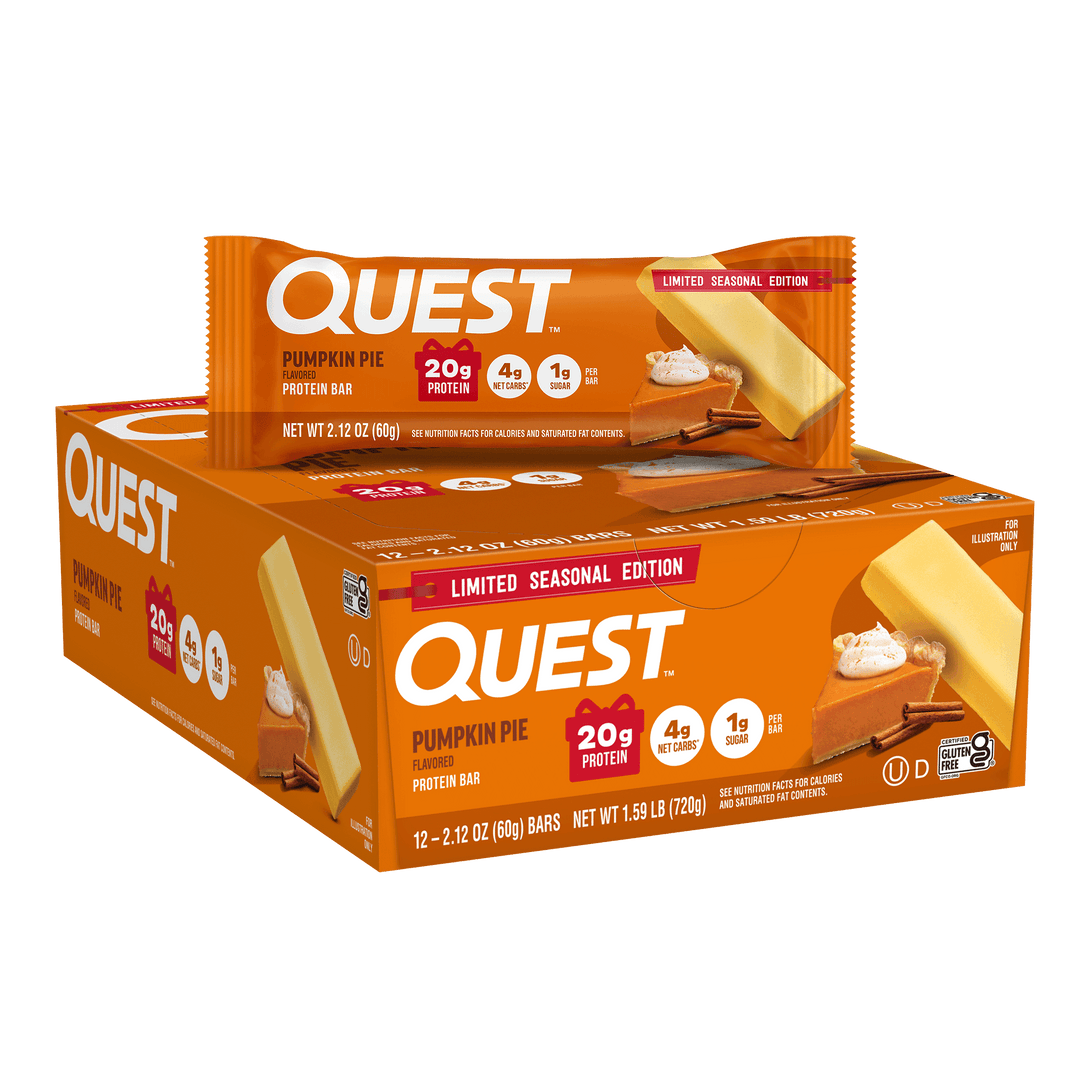 A box of Quest Pumpkin Pie protein bars with a single bar displayed in front, on a clean white background. The packaging is predominantly orange with white and red text, and the bar wrapper shows pumpkin pie, wafer, and whipped cream imagery.