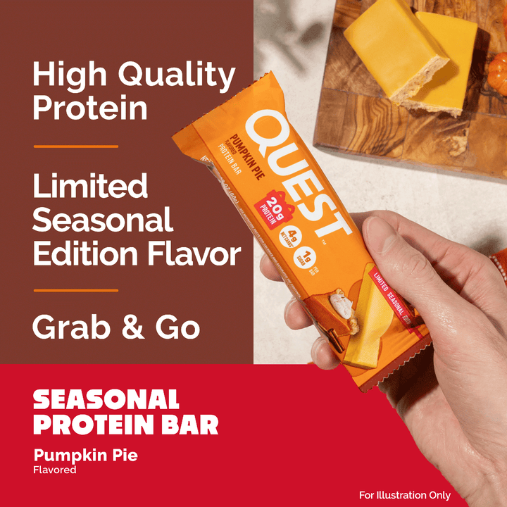 A hand holds a Quest pumpkin pie flavored protein bar package in an orange wrapper, with promotional text on the left and a background showing a sliced protein bar on a wooden board.