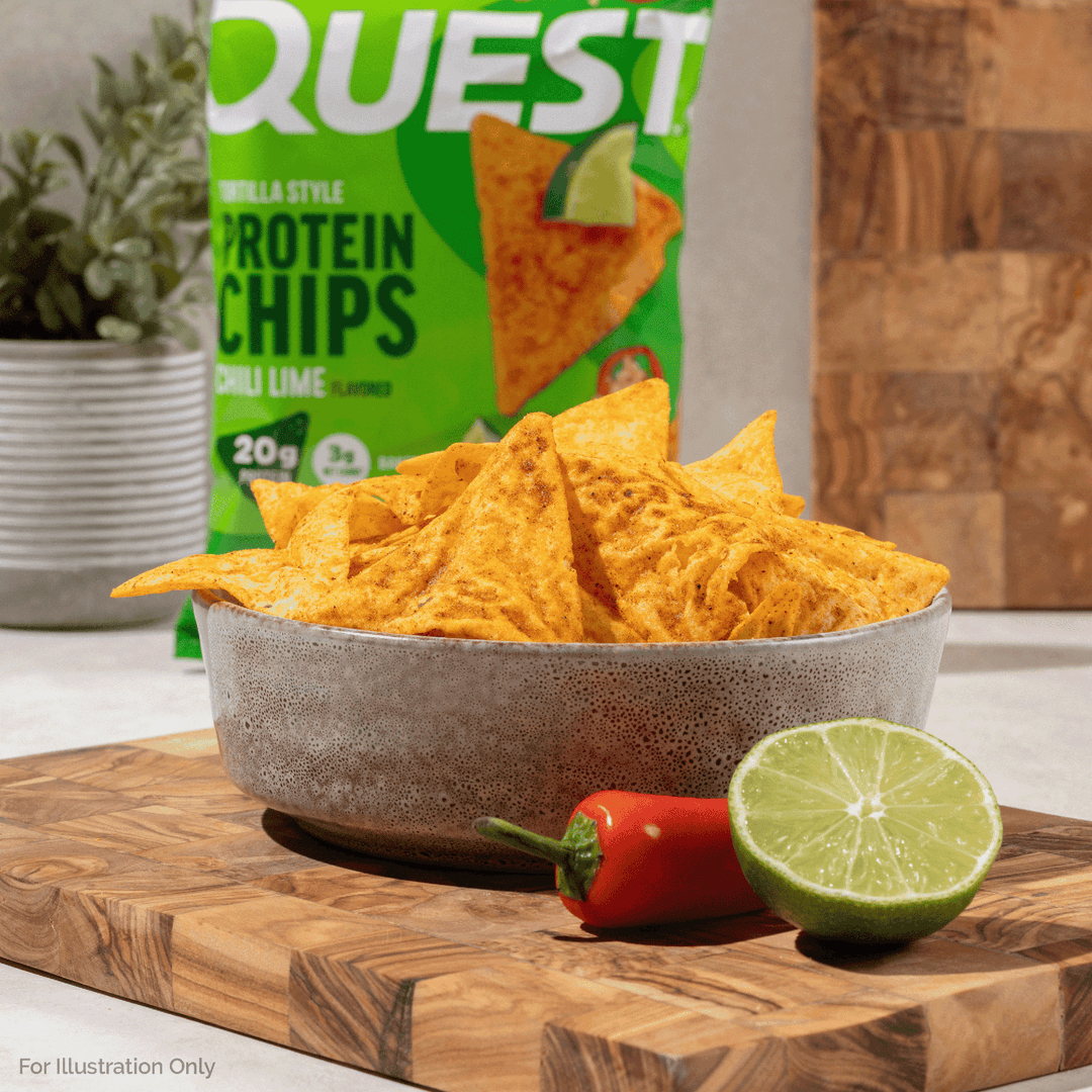Quest Chili Lime Tortilla Style Protein Chips bag with lime wedges, chili peppers, and tortilla chips.