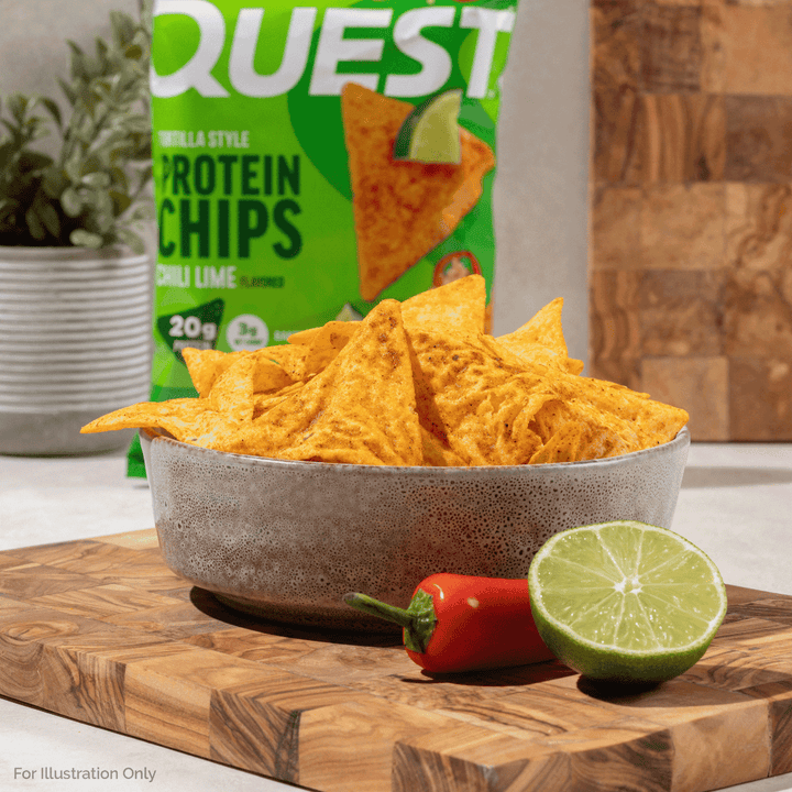 Quest Chili Lime Tortilla Style Protein Chips bag with lime wedges, chili peppers, and tortilla chips.