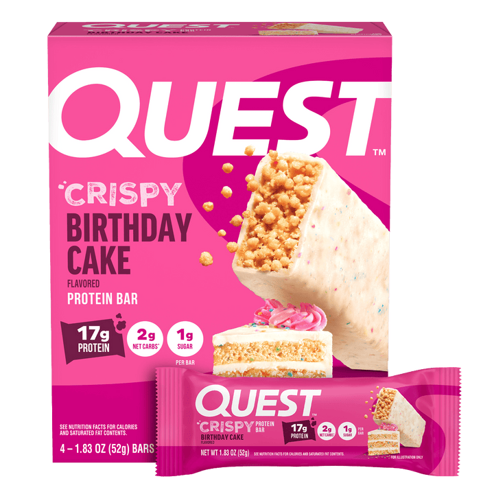 Quest Crispy Birthday Cake flavored protein bar packaging on a pink background