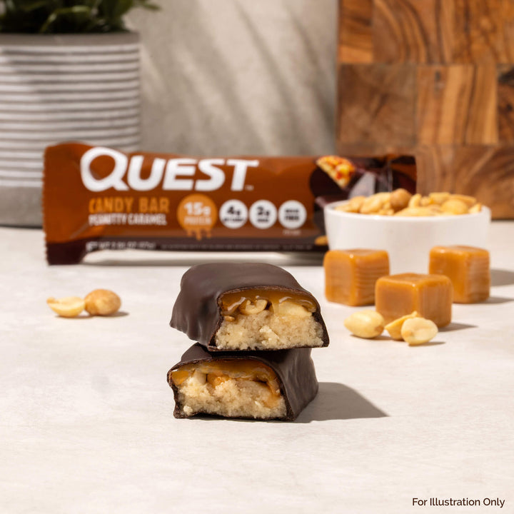 Quest Candy Bar with nuts and caramel pieces on a light surface
