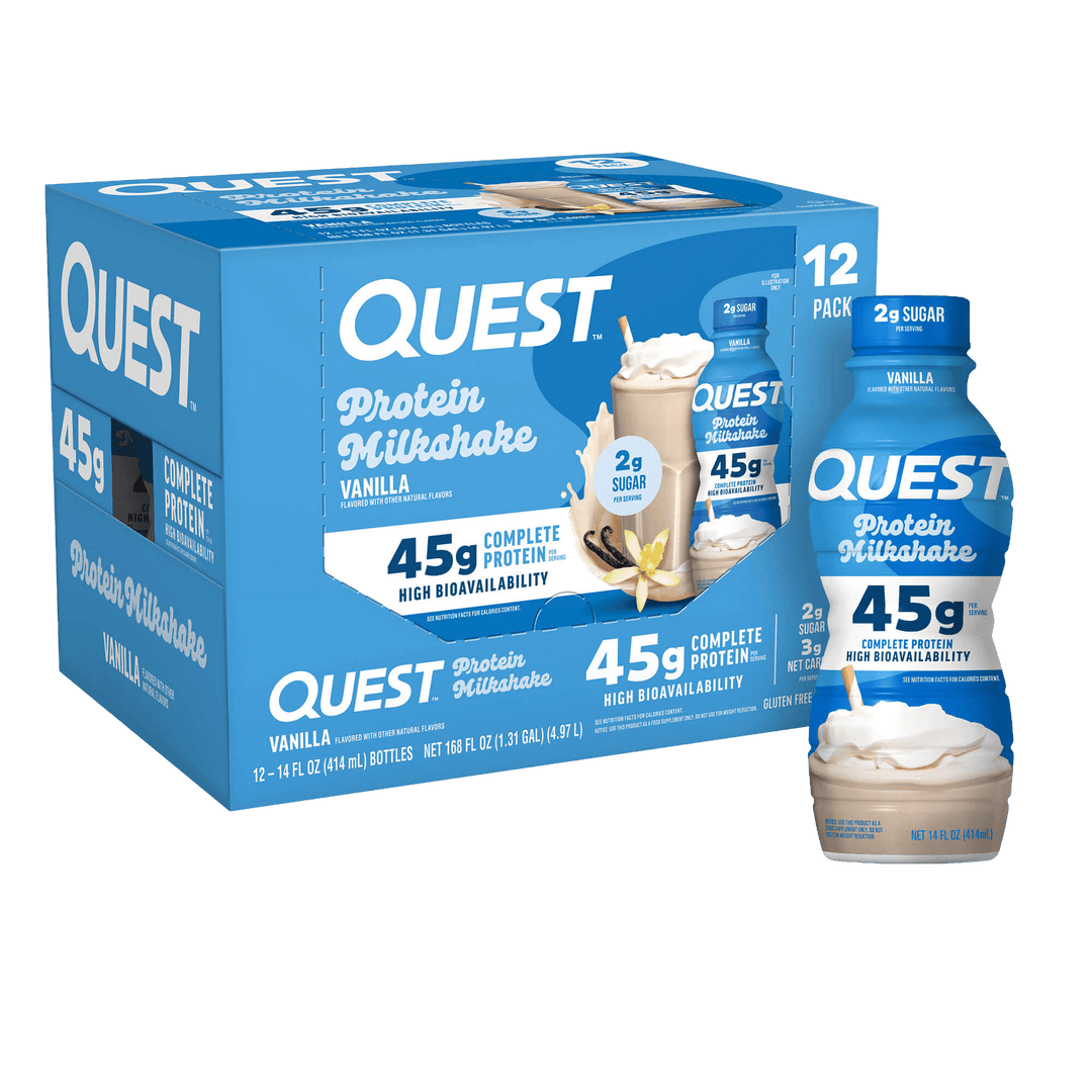 A blue box of Quest Protein Milkshake Vanilla, shown with two individual bottles and two milkshake cups in front on a plain white background.