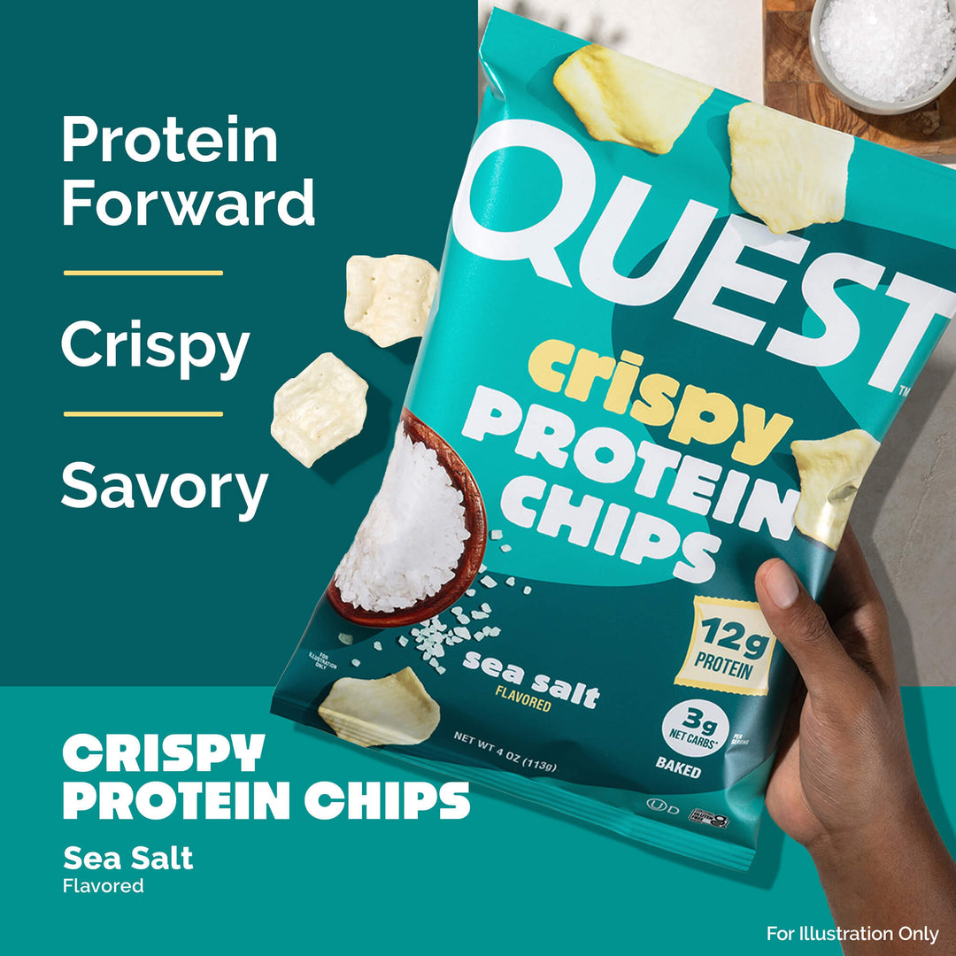 A hand holds a teal bag of Quest crispy protein chips with sea salt flavor. The packaging highlights 12g protein and 3g net carbs. Text reads "Protein Forward, Crispy, Savory."
