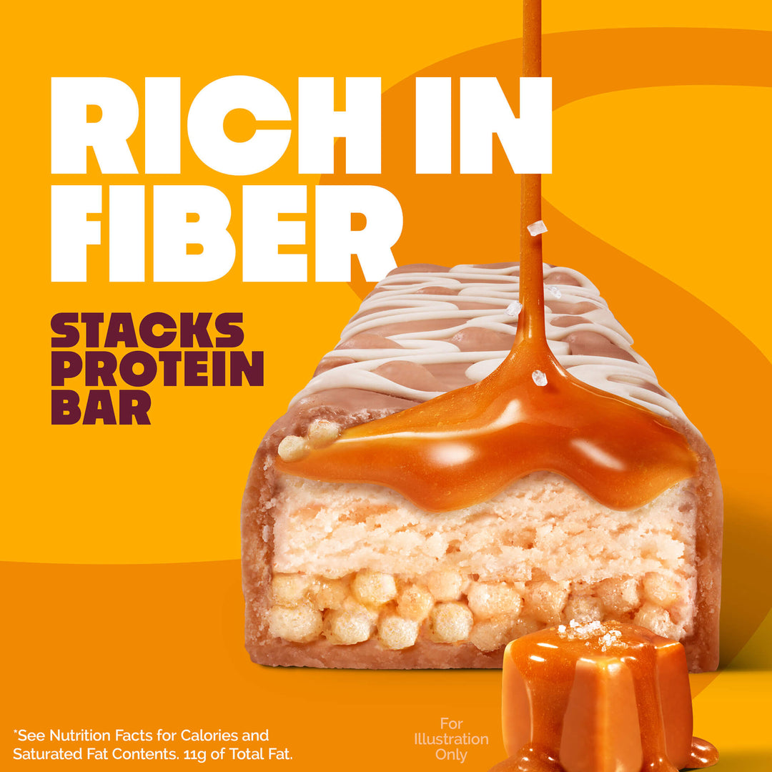 A caramel protein bar is shown with a glossy caramel drizzle. The text reads "Rich in Fiber Stacks Protein Bar" on a bright orange background.