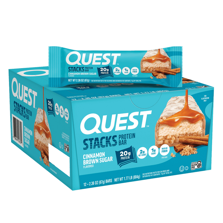 Box of Quest Stacks protein bars in cinnamon brown sugar flavor. Blue packaging highlights 20g protein, with a single bar displayed on top.