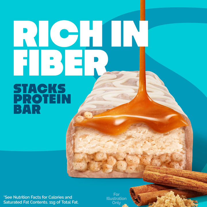 A protein bar with caramel drizzle is displayed against a blue background. Text reads “Rich in Fiber, Stacks Protein Bar.” Cinnamon sticks and brown sugar are at the bottom.