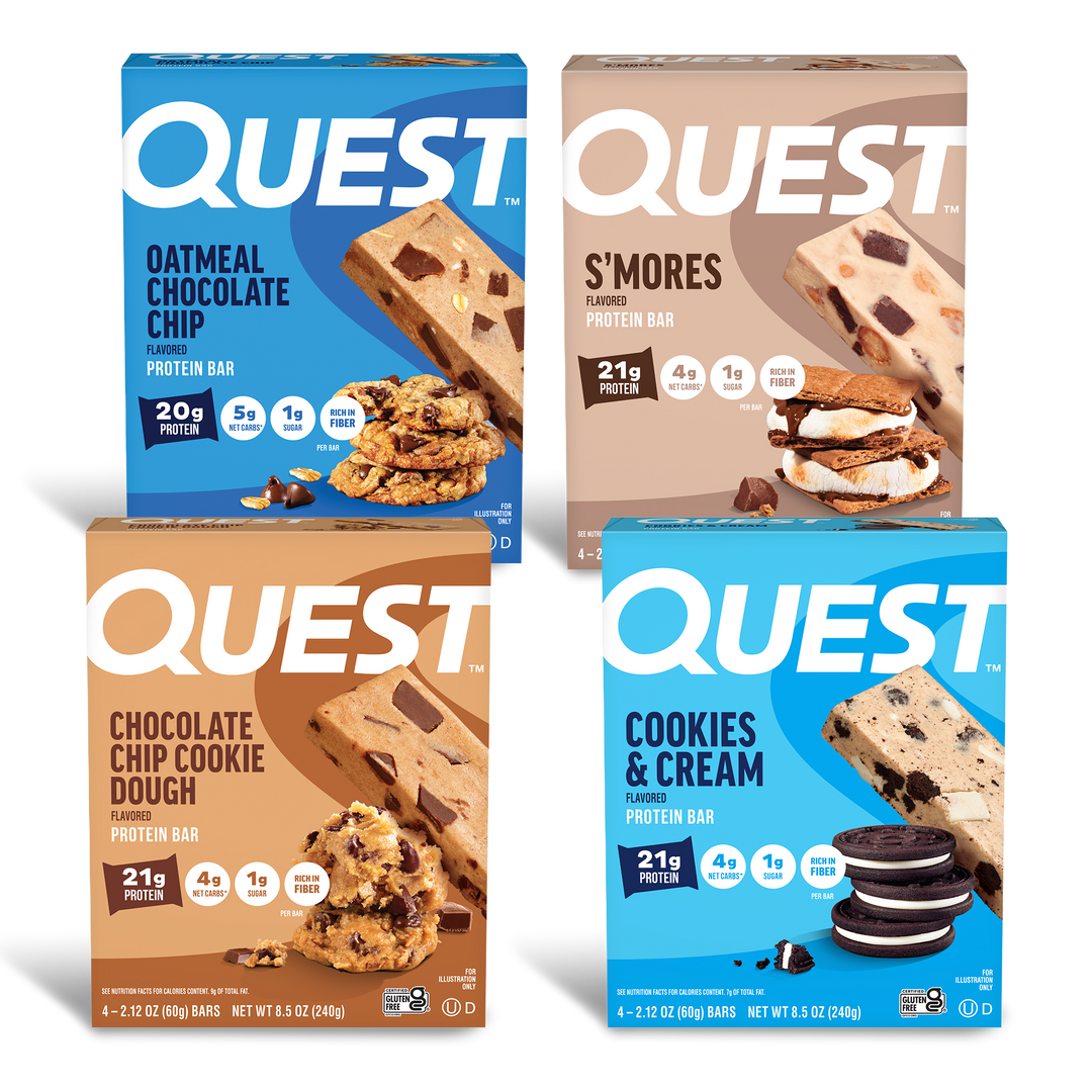Four Quest protein bar boxes against a black background. Flavors: Oatmeal Chocolate Chip, S'mores, Chocolate Chip Cookie Dough, and Cookies & Cream.